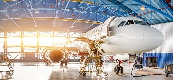 Commercial Airplane Undergoing Maintenance and Repairs in a Hangar