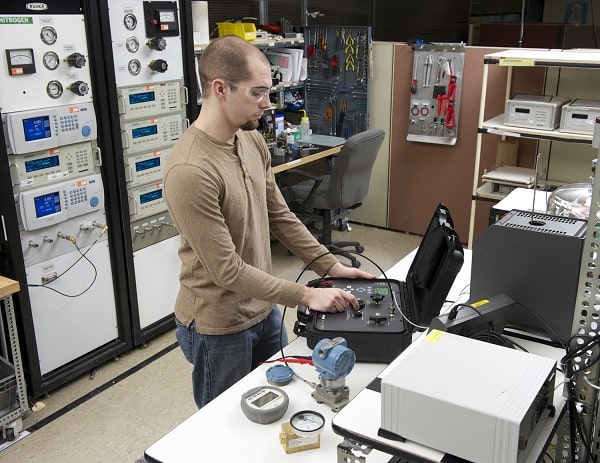 Technician Performing an Equipment Verification vs Calibration with Same Calibrator