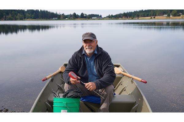 Mark Sytsma on Boat with Fluke Thermometer at Lone Lake